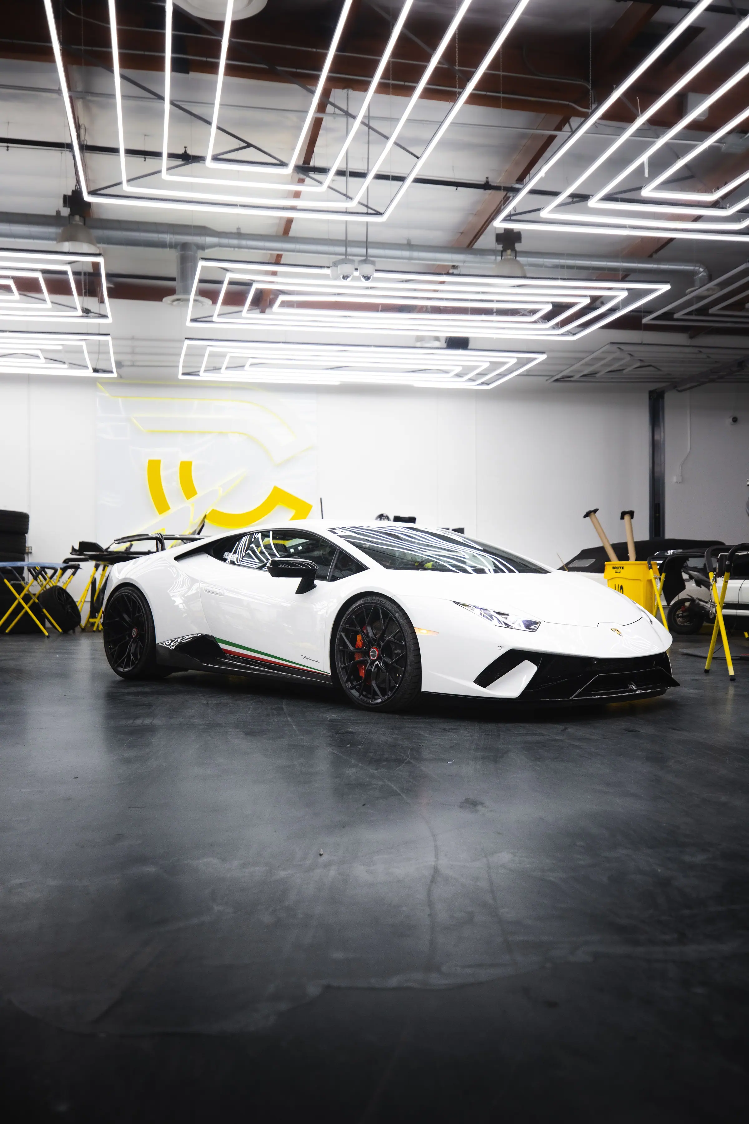 A gloss white Lamborghini Huracán wrapped by Wrap Workx, in the workshop